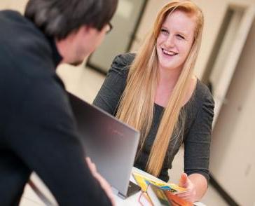 Two students talking about their business class